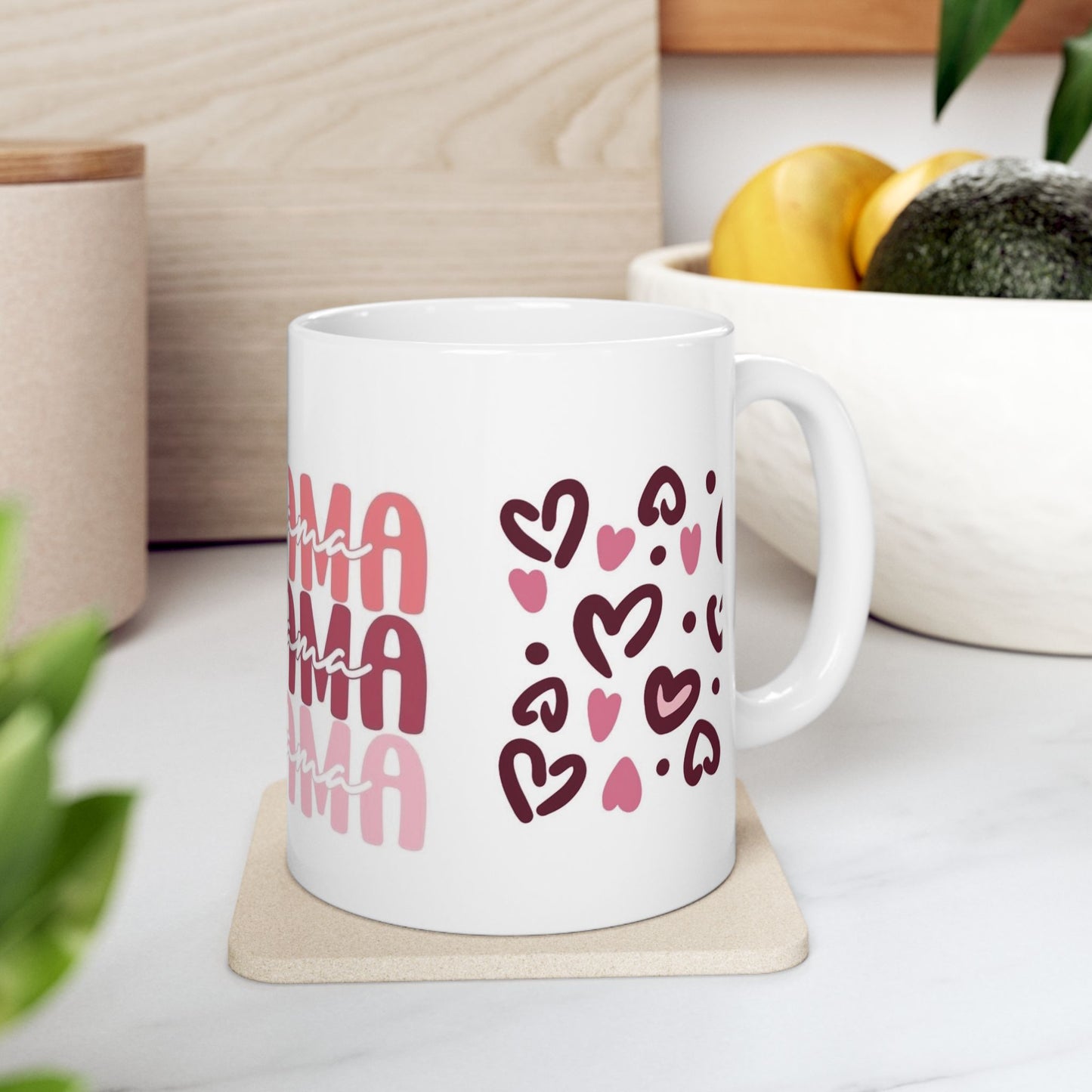 White ceramic mug with multiple pink ‘Mama’ text prints