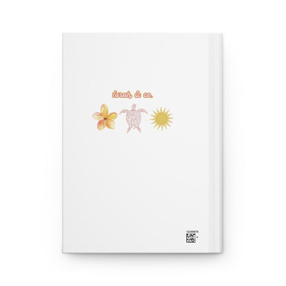 Notebook with floral and sun design on a white background