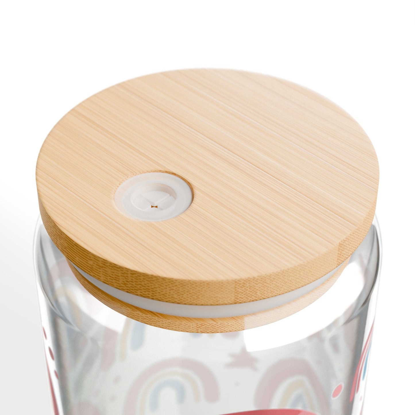 Clear glass tumbler with a wooden lid on a white background