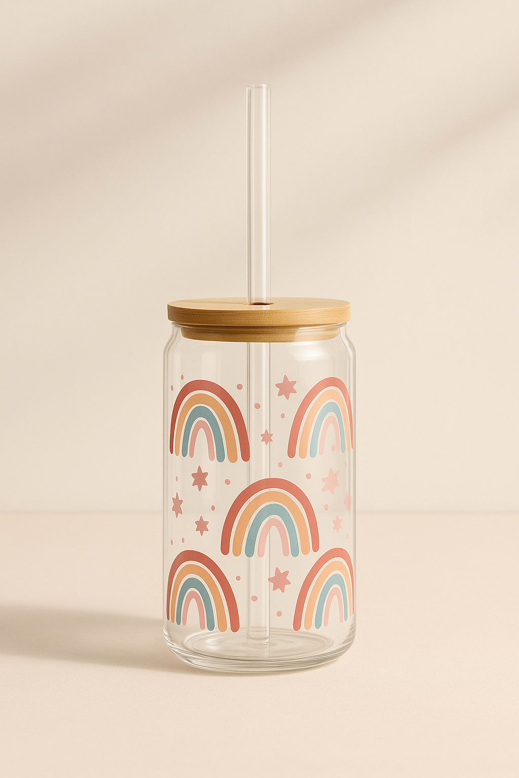Glass tumbler with wooden lid and rainbow design on a beige background