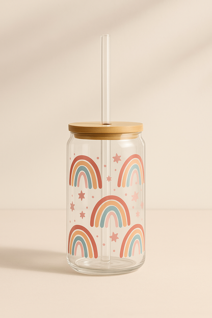 Glass tumbler with wooden lid and rainbow design on a beige background