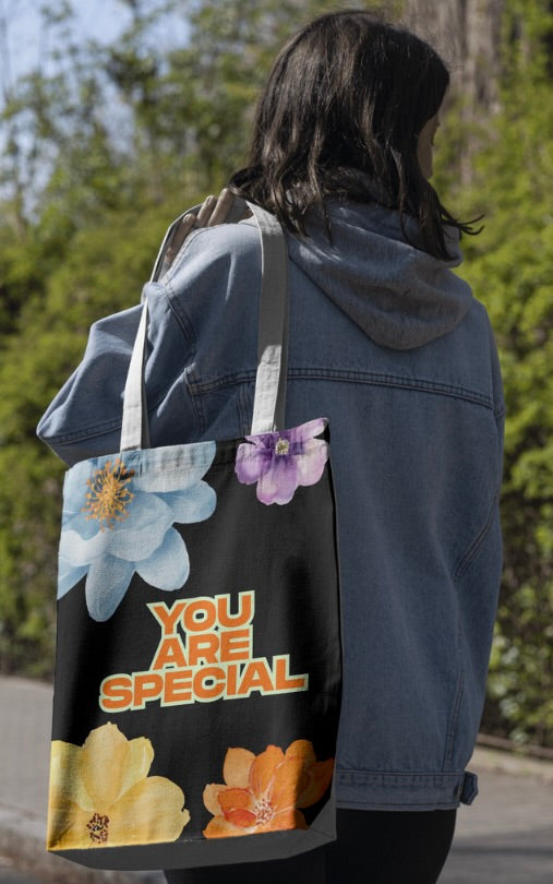 Tote bag with blue and purple flowers and 'You Are Special' text